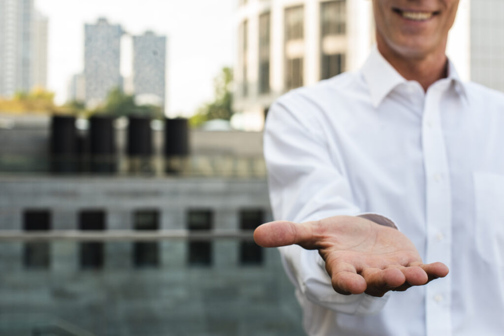 close-up-businessman-holding-hand-out